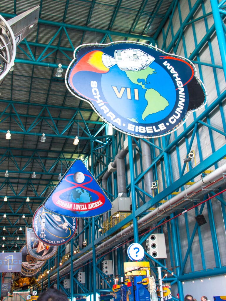 Apollo banners hanging from the ceiling of the Saturn V center at Kennedy Space Center