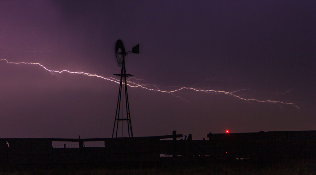 Lightning behind a windmill