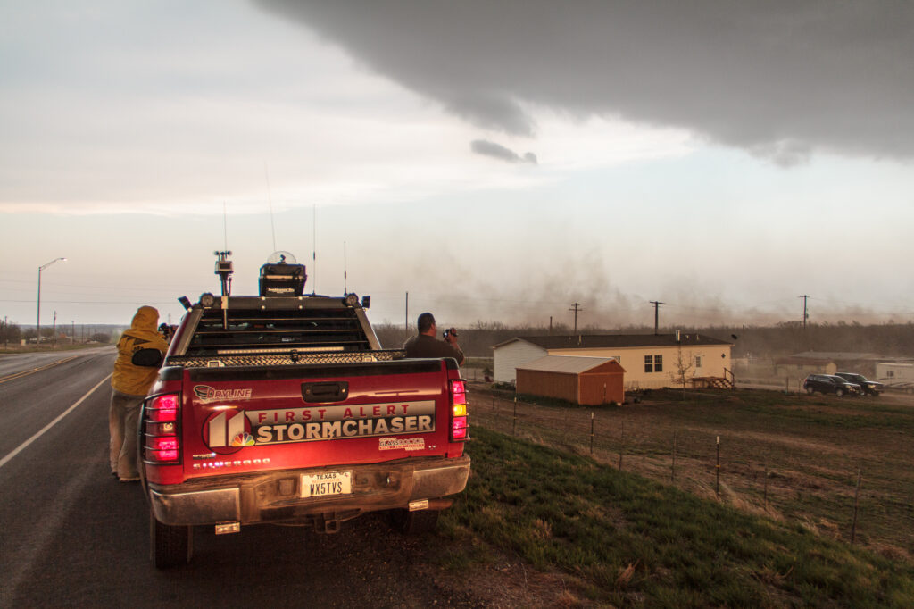 Outflow blowing up dust